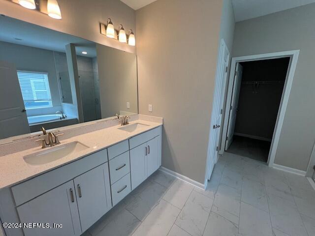 47 Archstone Way Street, Unit 3 St. Augustine, FL 32092 - Photo 8 of 19 a bathroom with a double vanity sink and a mirror