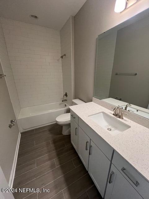 47 Archstone Way Street, Unit 3 St. Augustine, FL 32092 - Photo 9 of 19 a bathroom with a double vanity sink toilet mirror and bathtub