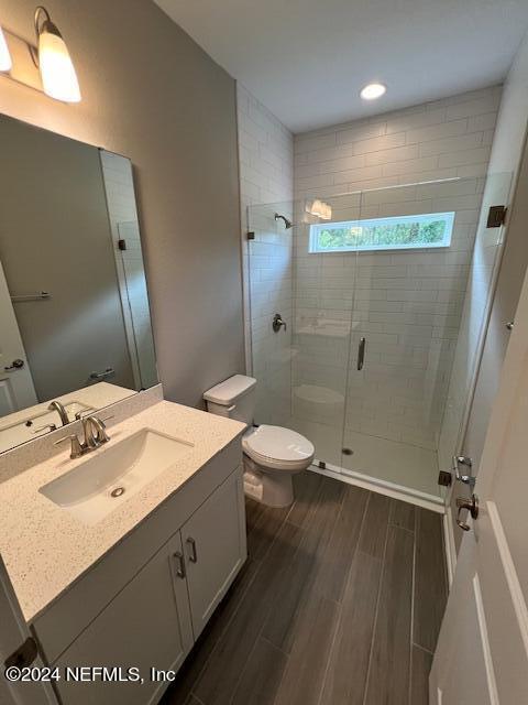 47 Archstone Way Street, Unit 3 St. Augustine, FL 32092 - Photo 10 of 19 a bathroom with a sink a toilet and shower