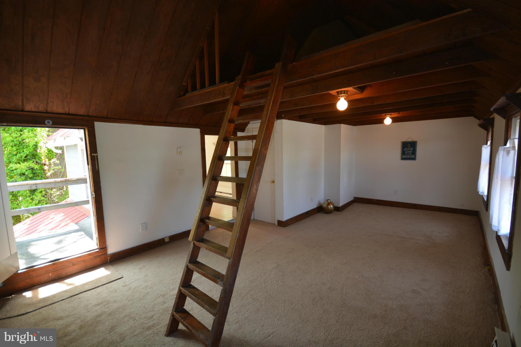 7414 Back Street Newcomb, MD 21653 - Photo 9 of 14 Loft in apartment for storage or sleeping space.