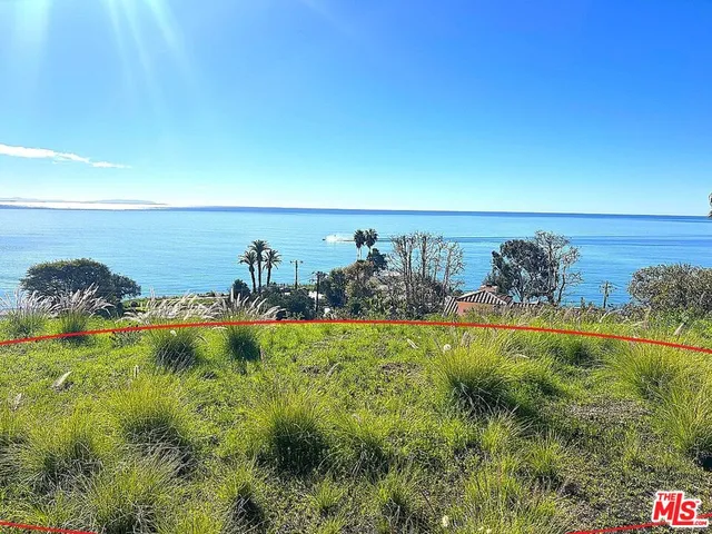 a view of balcony with a yard