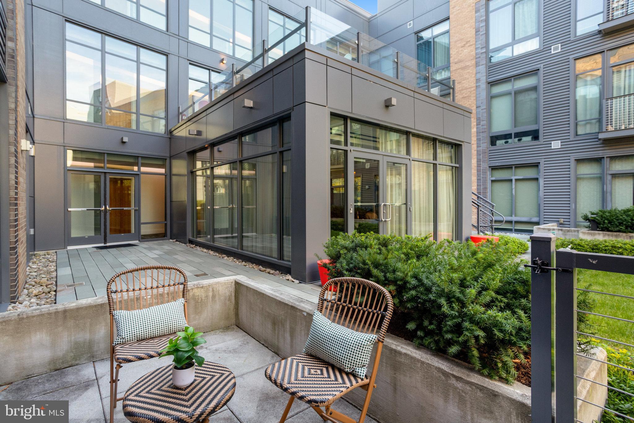 525 Water Street Southwest, Unit 223 Washington, DC 20024 - Photo 11 of 68 a view of a patio with couches table and chairs and potted plants