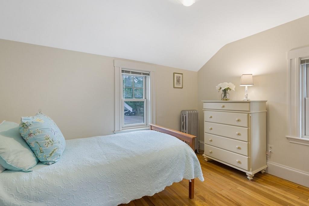 44 Sutherland Road Arlington, MA 02476 - Photo 15 of 21 a bedroom with a bed and a dresser