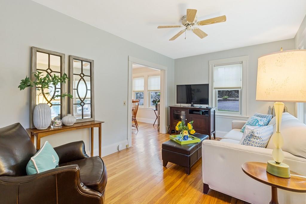 44 Sutherland Road Arlington, MA 02476 - Photo 3 of 21 a living room with furniture a fireplace and a flat screen tv