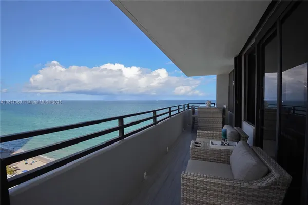 a view of balcony and furniture
