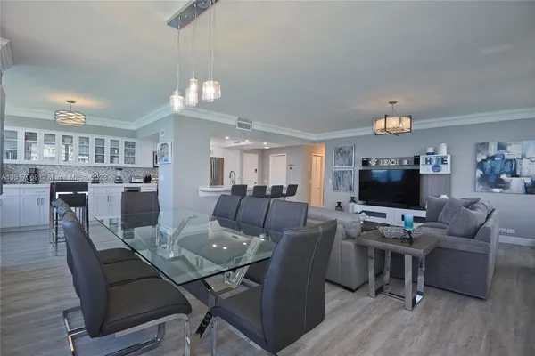 a view of a dining room with furniture and wooden floor