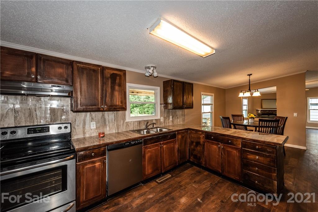 4638 Barrier Road Concord, NC 28025 - Photo 11 of 43 a kitchen with lots of counter top space and appliances