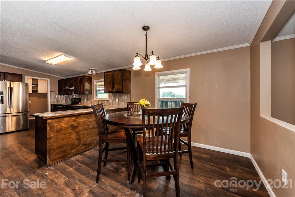 4638 Barrier Road Concord, NC 28025 - Photo 15 of 43 a view of a dining room with furniture and window