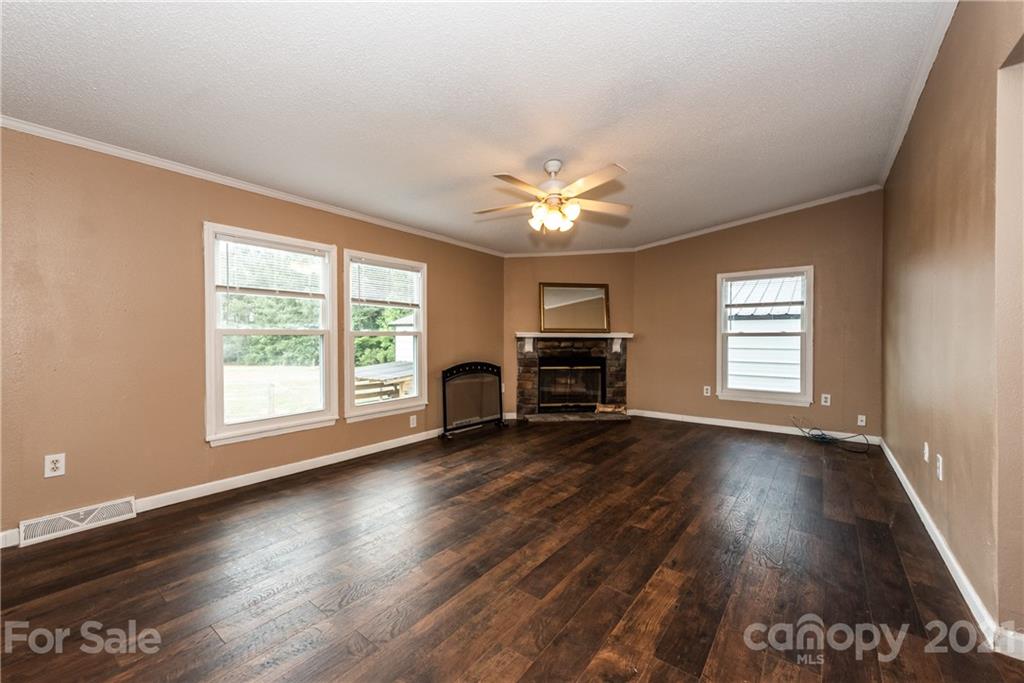 4638 Barrier Road Concord, NC 28025 - Photo 16 of 43 wooden floor in an empty room with a window