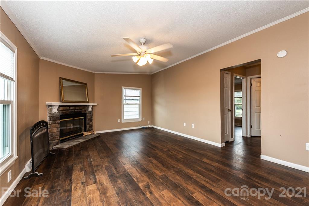 4638 Barrier Road Concord, NC 28025 - Photo 17 of 43 wooden floor in an empty room with a window
