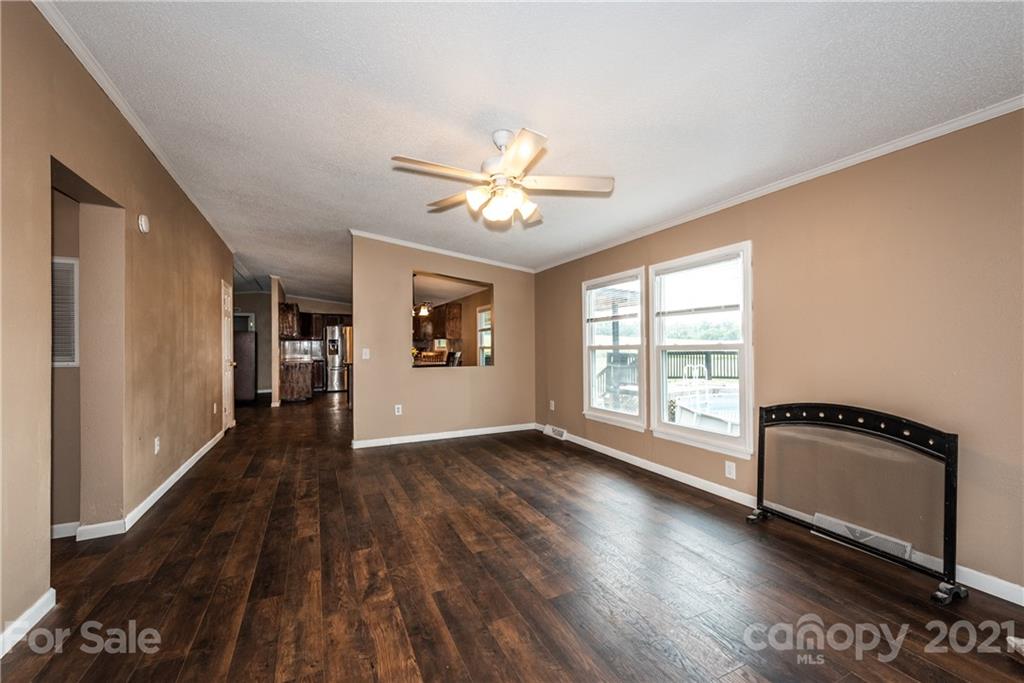 4638 Barrier Road Concord, NC 28025 - Photo 19 of 43 wooden floor in an empty room with a window