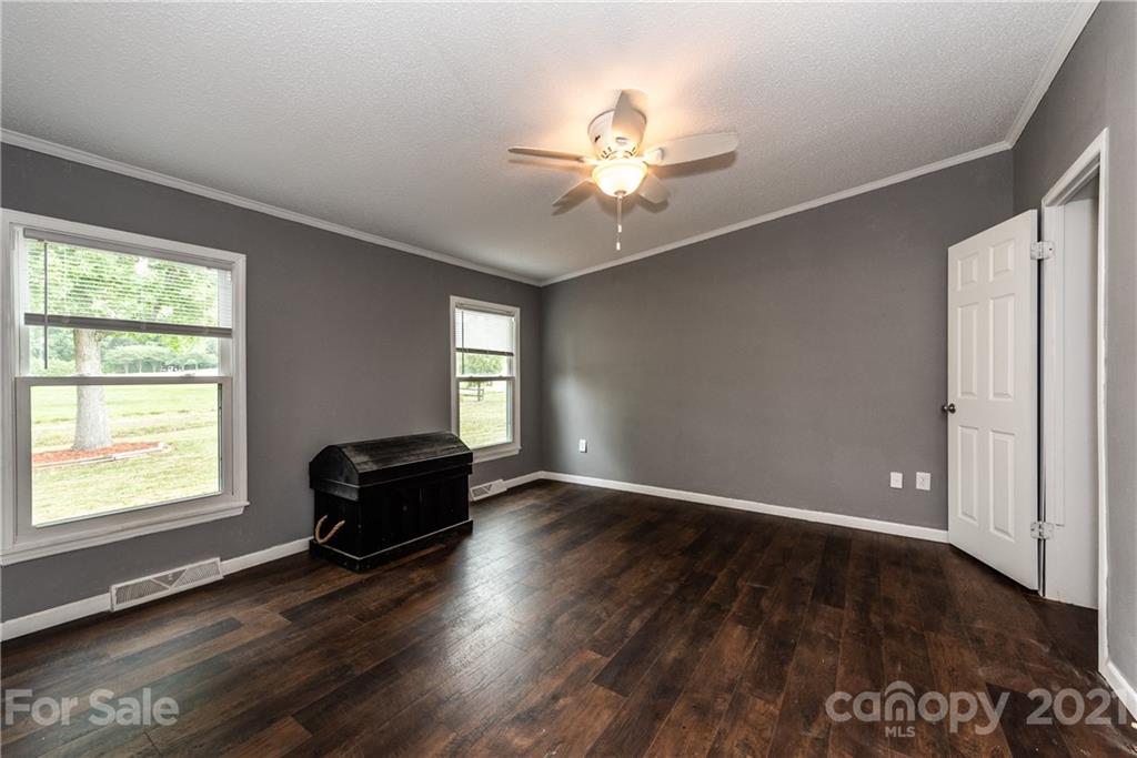 4638 Barrier Road Concord, NC 28025 - Photo 20 of 43 a living room with a window and wooden floor