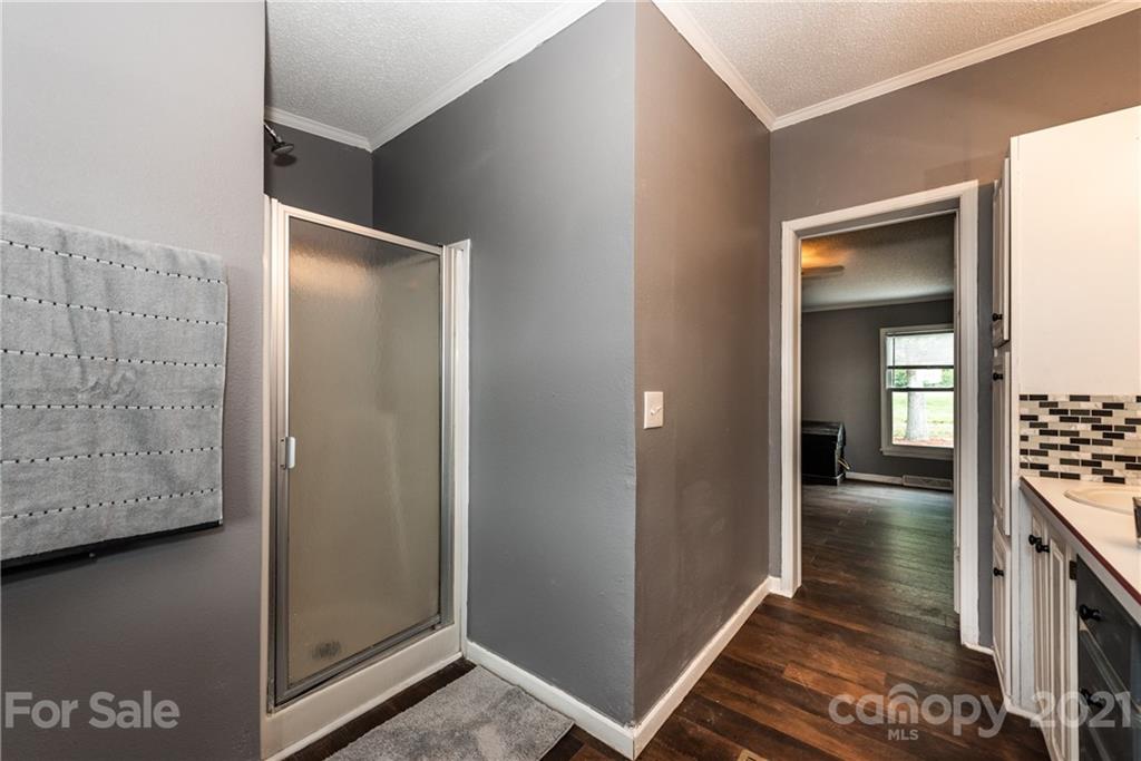 4638 Barrier Road Concord, NC 28025 - Photo 25 of 43 a view of hallway with stairs and wooden floor