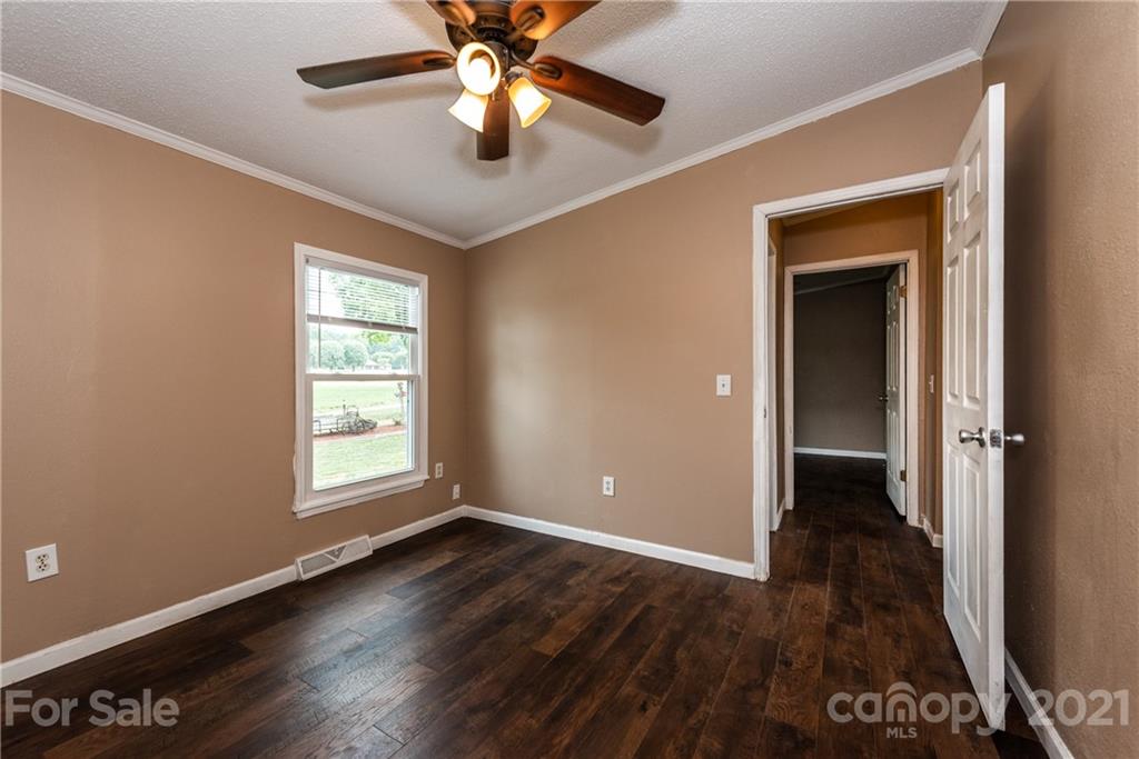 4638 Barrier Road Concord, NC 28025 - Photo 26 of 43 wooden floor in an empty room with a window