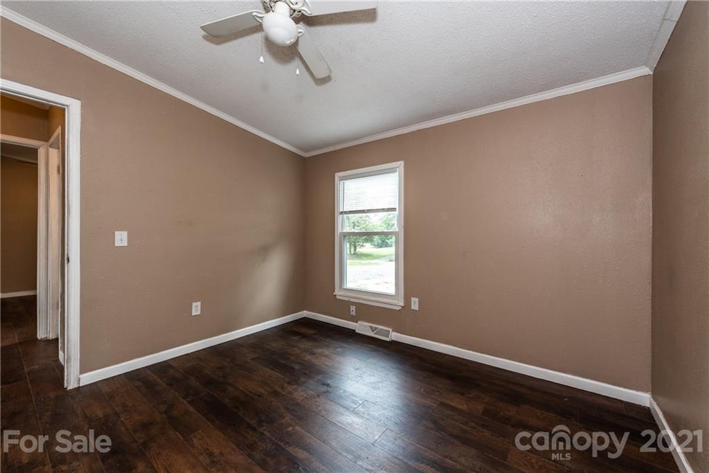4638 Barrier Road Concord, NC 28025 - Photo 27 of 43 wooden floor in an empty room with a window
