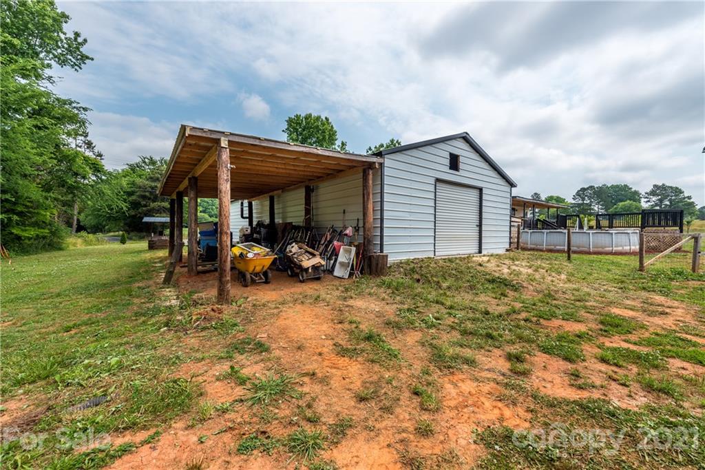 4638 Barrier Road Concord, NC 28025 - Photo 32 of 43 a view of a house with backyard