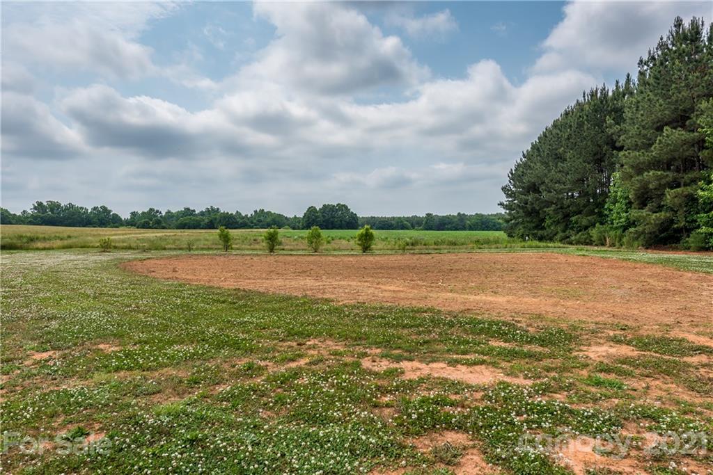 4638 Barrier Road Concord, NC 28025 - Photo 35 of 43 a view of a lake with houses in the back