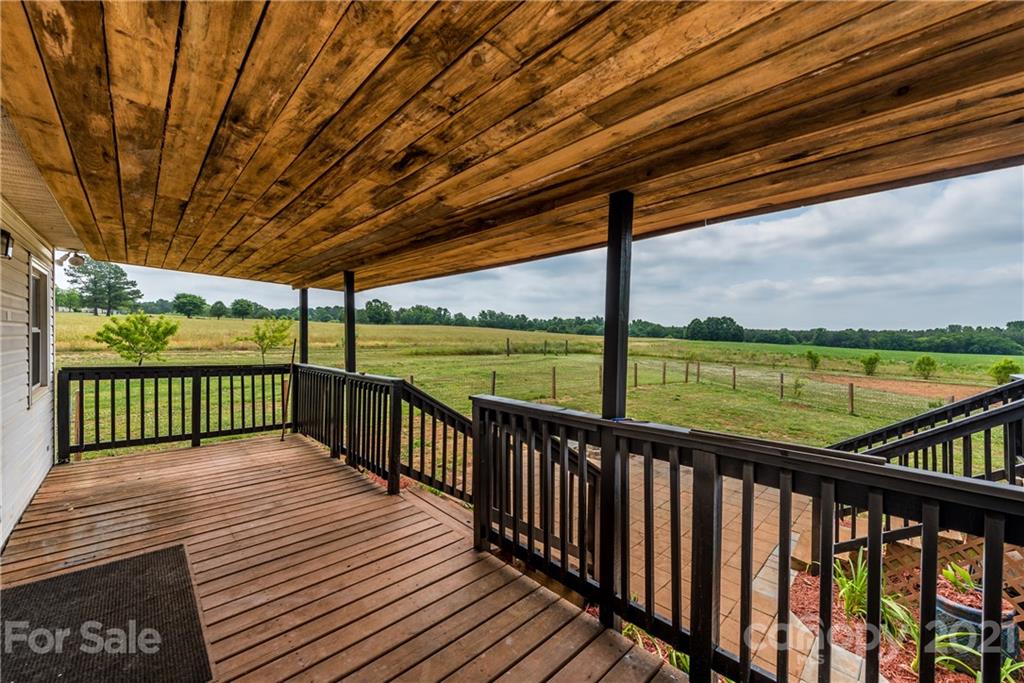 4638 Barrier Road Concord, NC 28025 - Photo 38 of 43 a view of a wooden deck with a ocean view