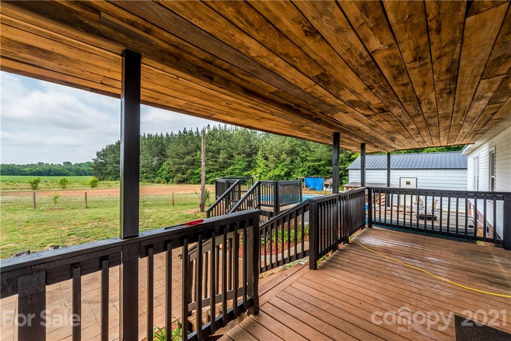 4638 Barrier Road Concord, NC 28025 - Photo 39 of 43 a view of a wooden deck