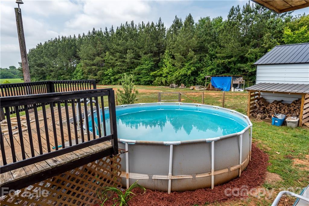 4638 Barrier Road Concord, NC 28025 - Photo 40 of 43 a view of a swimming pool with a yard