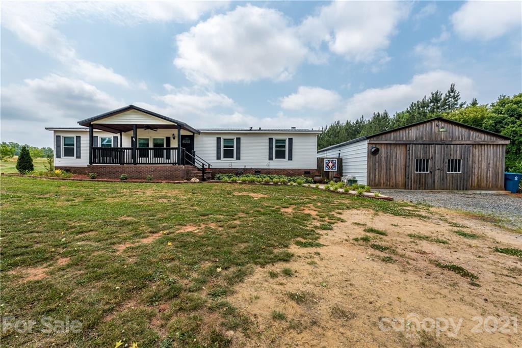 4638 Barrier Road Concord, NC 28025 - Photo 42 of 43 a view of a house with a yard