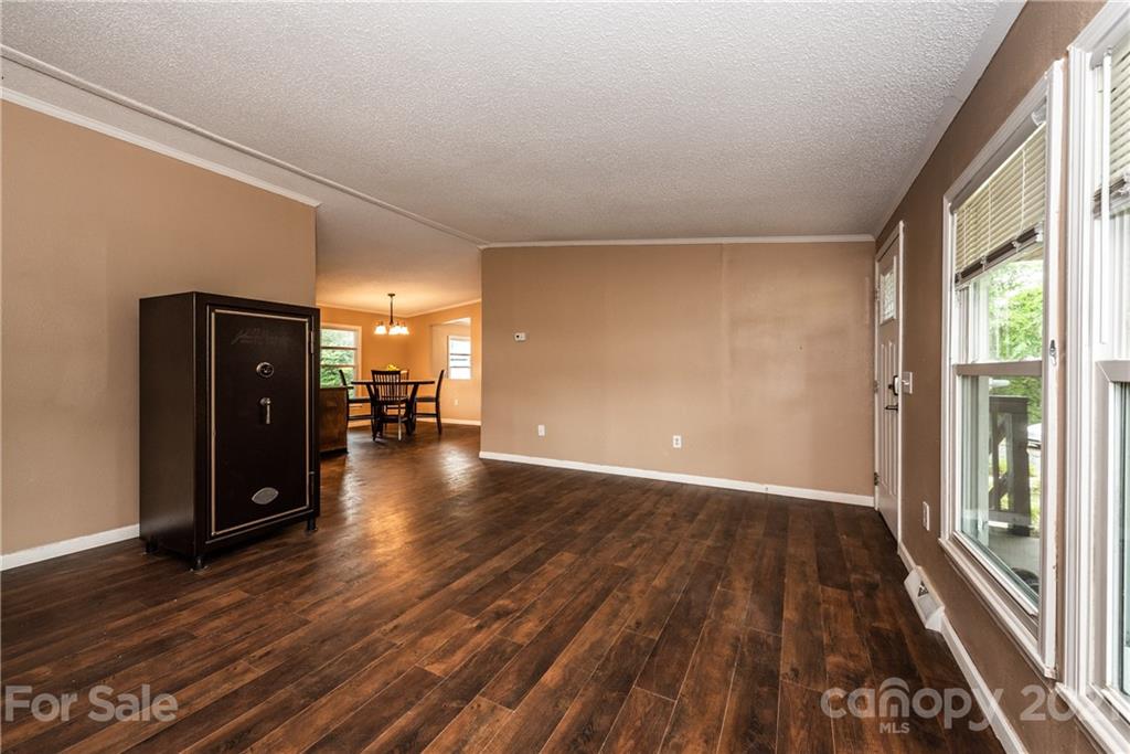 4638 Barrier Road Concord, NC 28025 - Photo 6 of 43 wooden floor in an empty room with a window