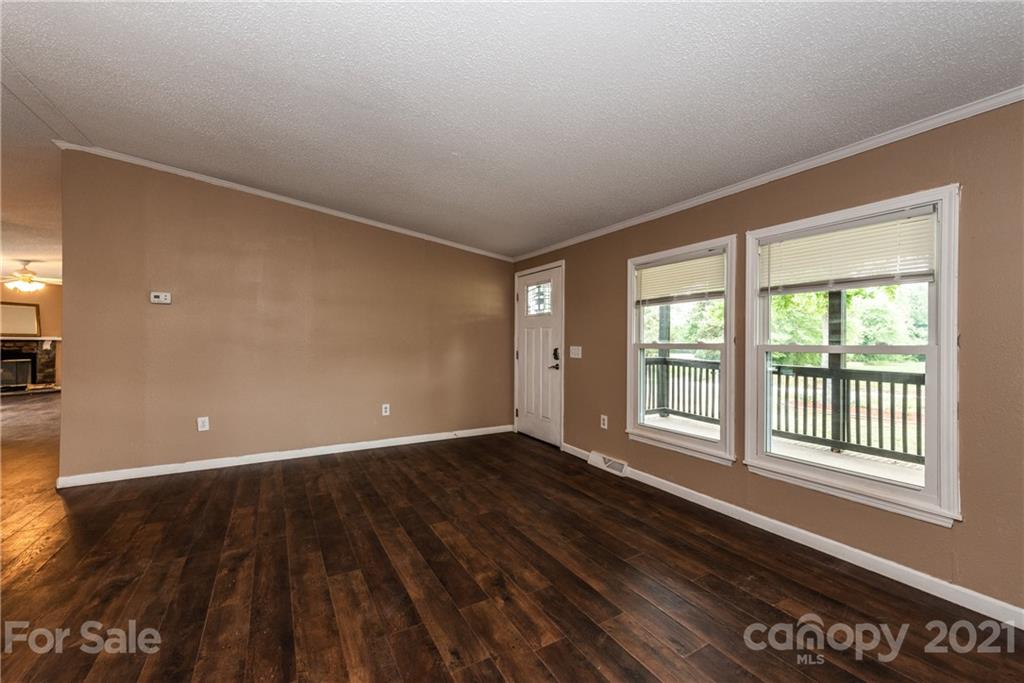 4638 Barrier Road Concord, NC 28025 - Photo 7 of 43 wooden floor in an empty room with a window