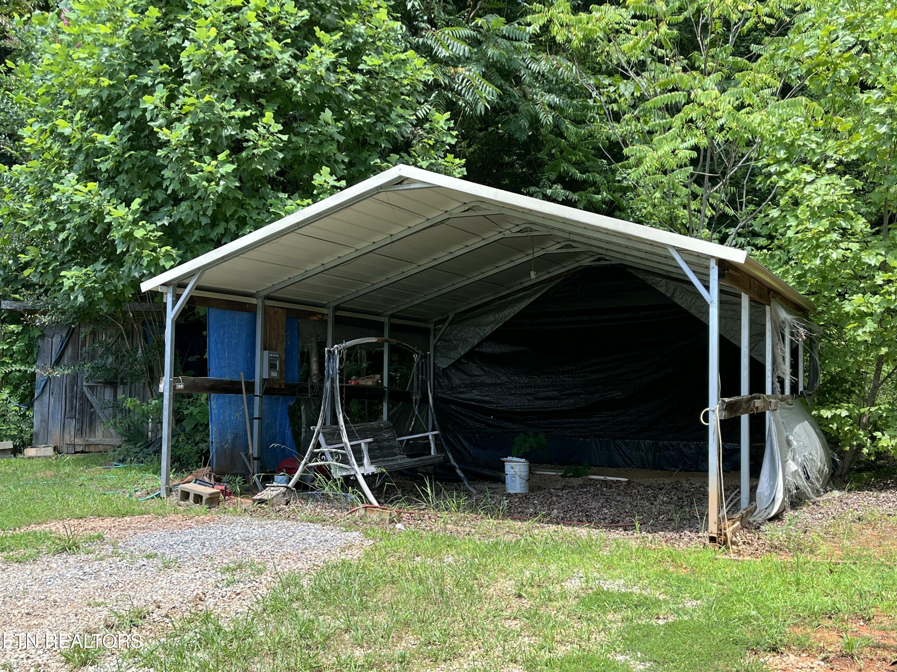 380 Harrison Road Madisonville, TN 37354 - Photo 18 of 22 380 Harrison Rd carport