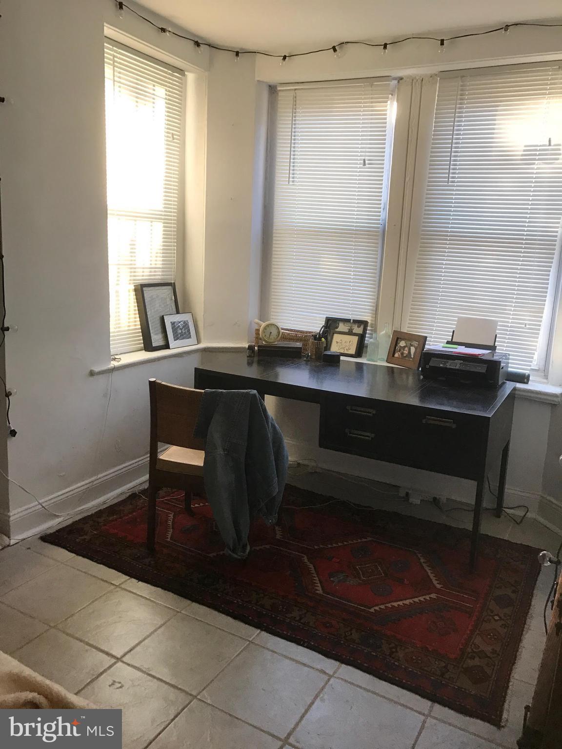 11 N Street Northwest Washington, DC 20001 - Photo 11 of 17 a view of a workspace with furniture and a window