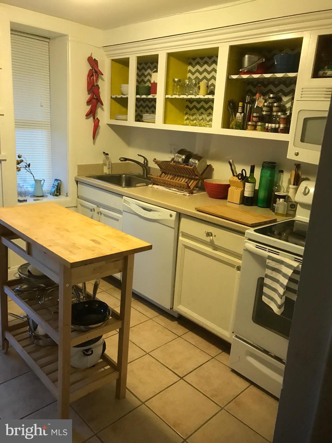 11 N Street Northwest Washington, DC 20001 - Photo 14 of 17 a kitchen with a sink and cabinets