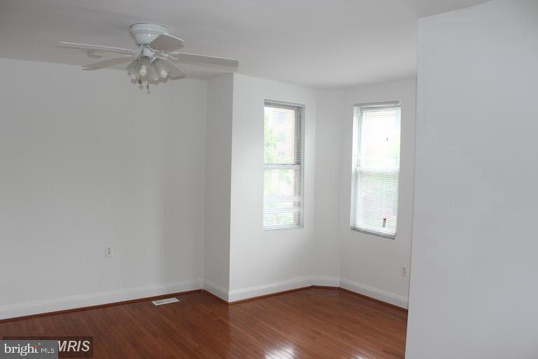 11 N Street Northwest Washington, DC 20001 - Photo 4 of 17 wooden floor in an empty room with a window
