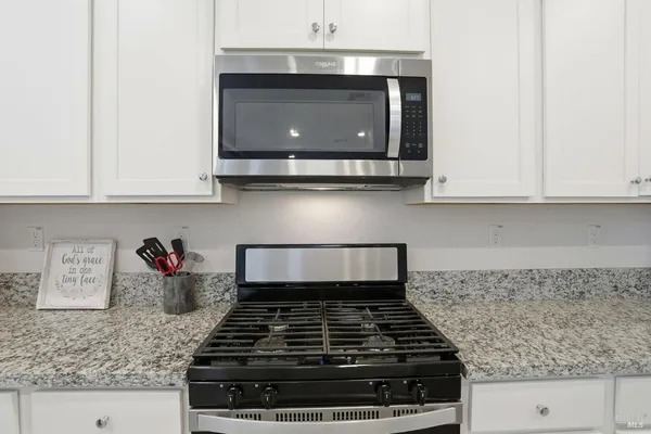 a kitchen with a sink and a refrigerator