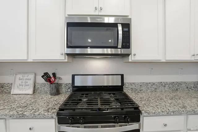 a kitchen with a sink and a refrigerator