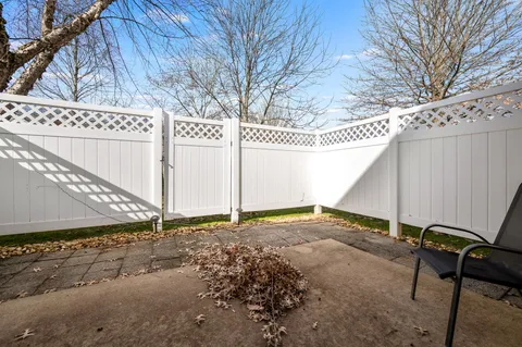 a backyard of a house with outdoor seating