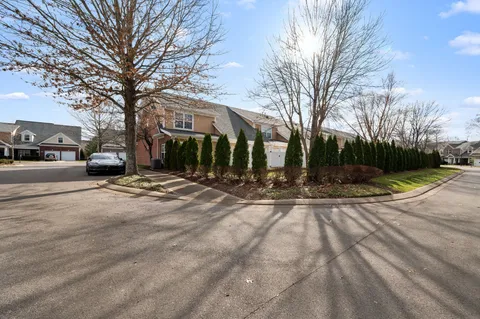 a view of a house with a street