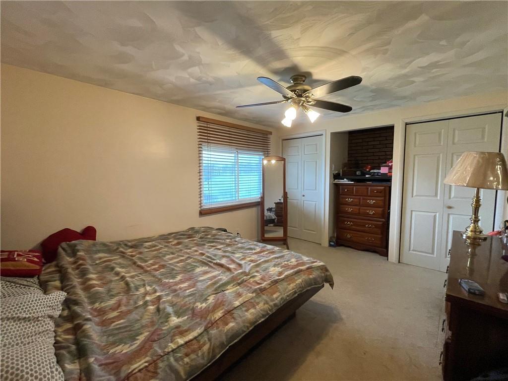 112 Mechling Road Kittanning, PA 16201 - Photo 12 of 25 a bedroom with a bed and a chandelier