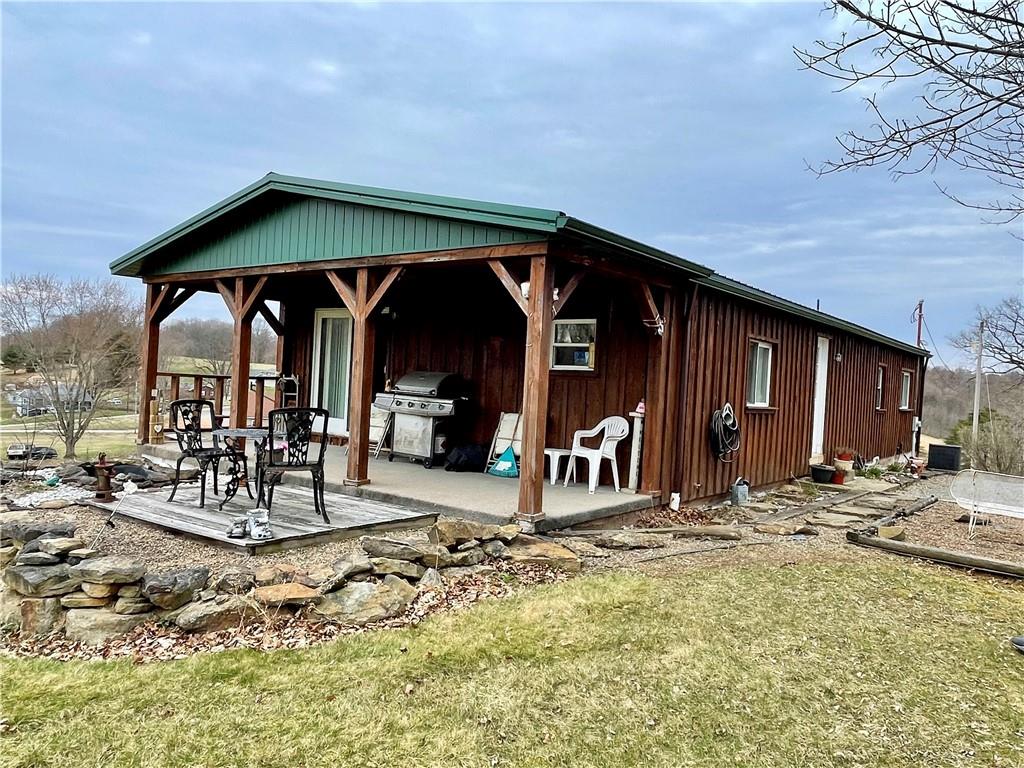 112 Mechling Road Kittanning, PA 16201 - Photo 4 of 25 a view of a chairs and table in patio