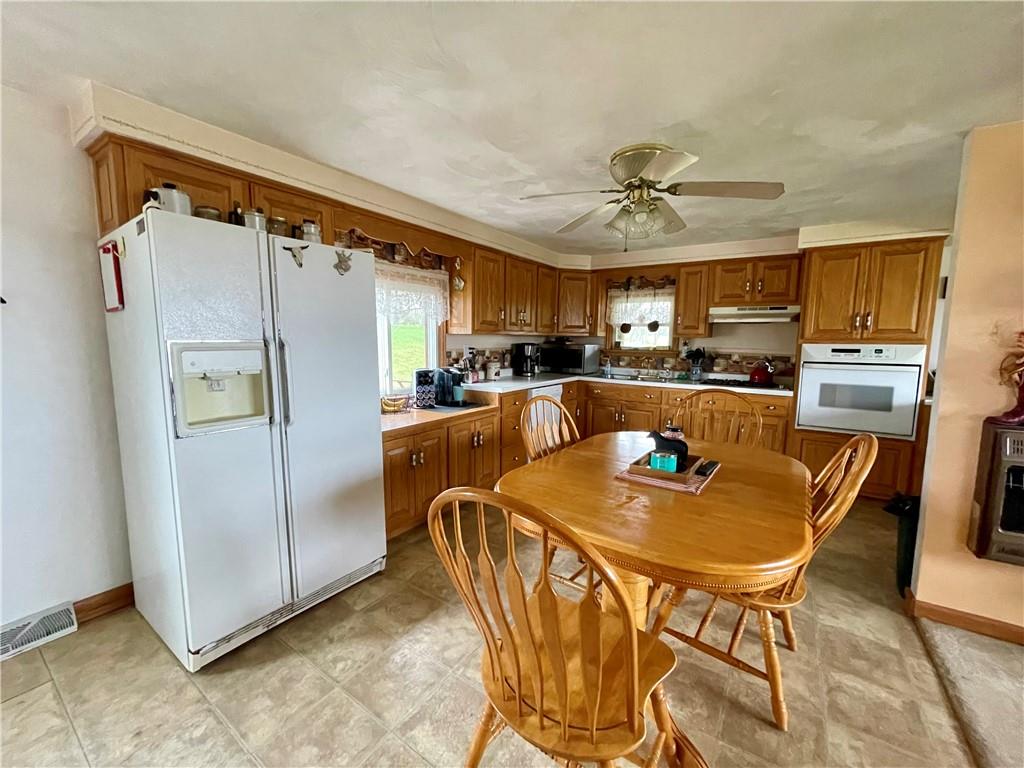 112 Mechling Road Kittanning, PA 16201 - Photo 6 of 25 a dining table chair next to a window