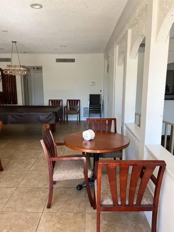 a room with a table and chairs