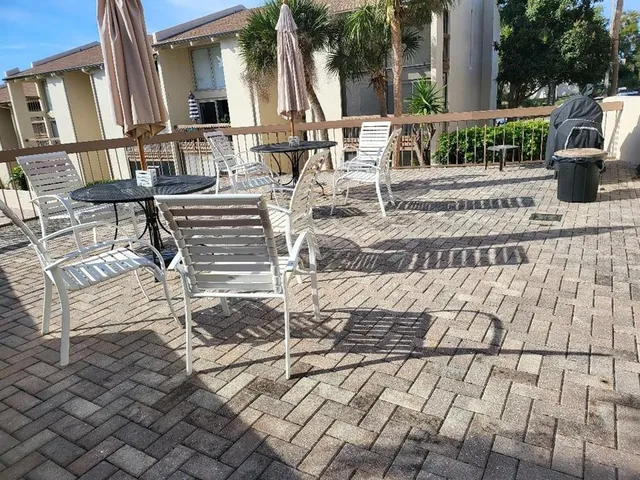 a view of a swimming pool with a table and chairs