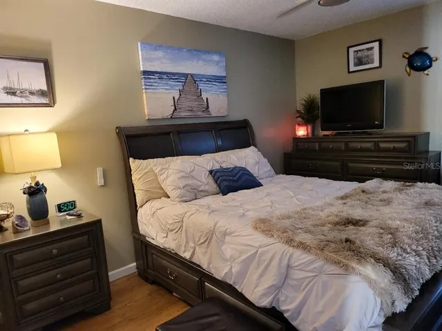 a bedroom with a bed and cupboard