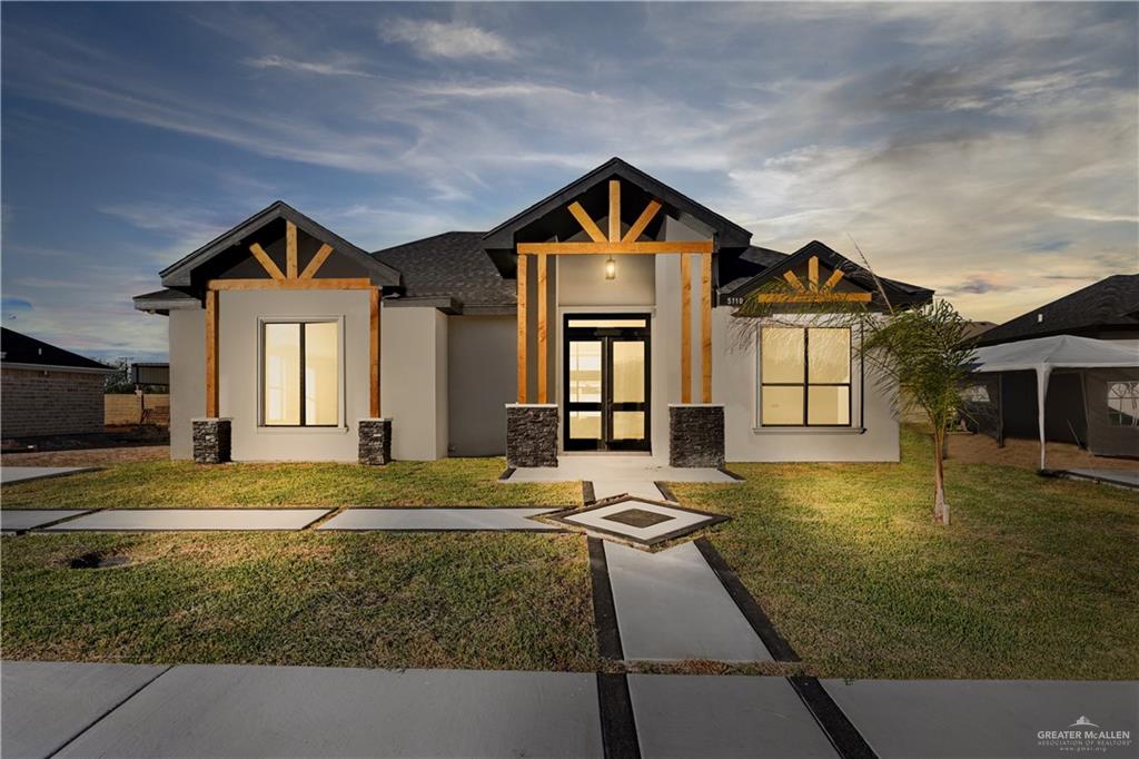 5110 Blackbird Rio Grande City, TX 78582 - Photo 1 of 1 a front view of a house with a yard