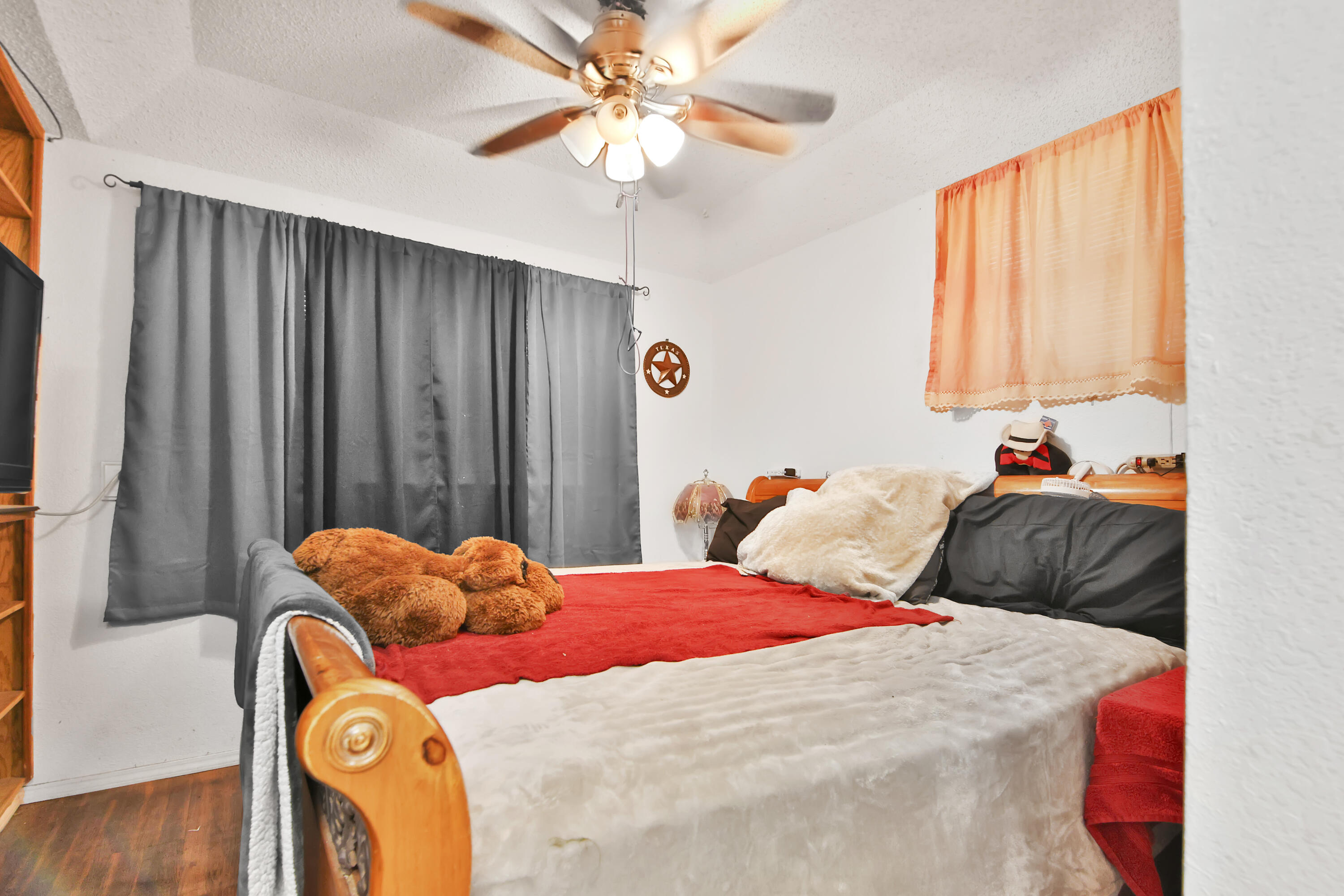 1211 140th Street Lubbock, TX 79423 - Photo 11 of 48 a bedroom with a bed and a window