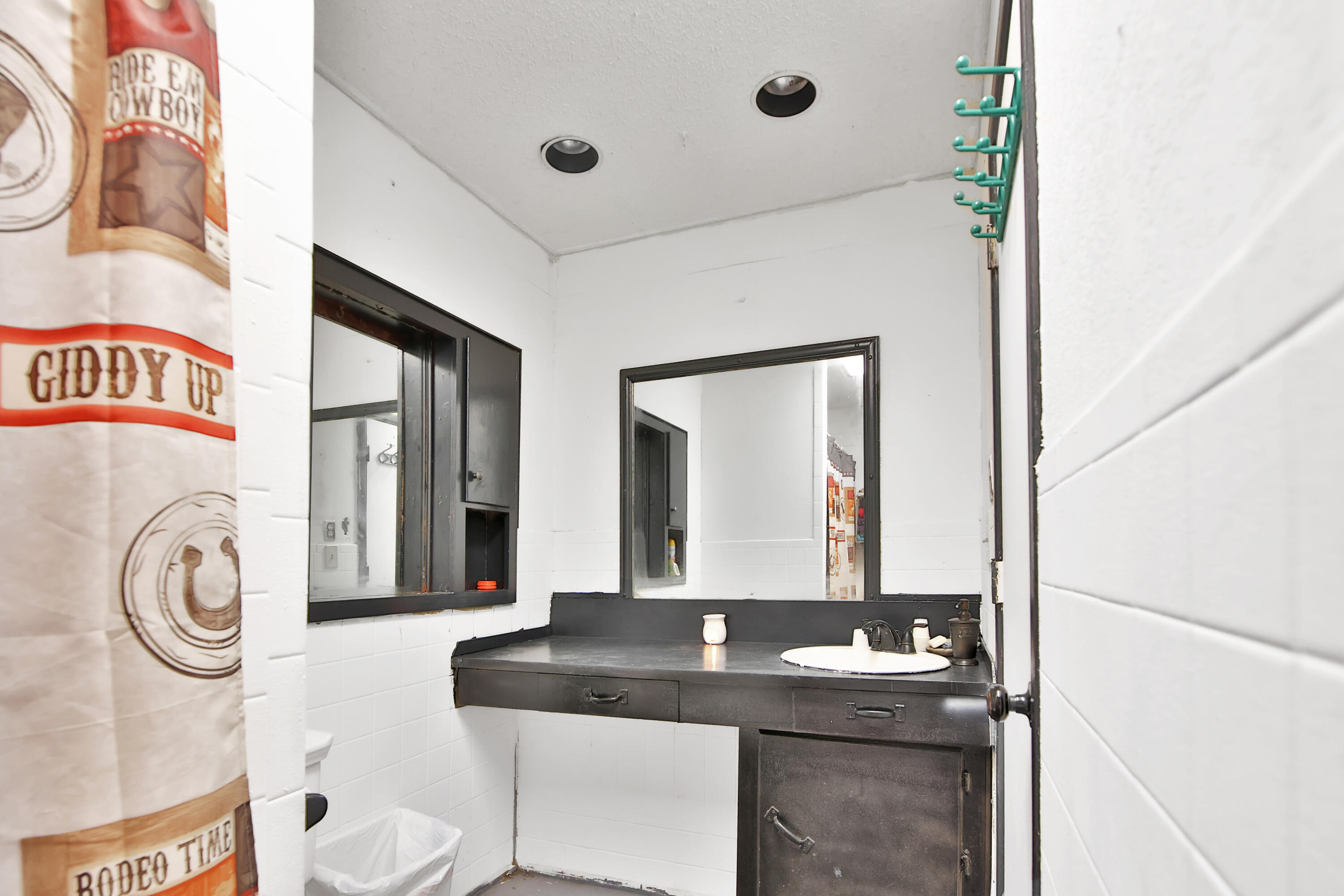 1211 140th Street Lubbock, TX 79423 - Photo 14 of 48 a bathroom with a granite countertop sink and a mirror