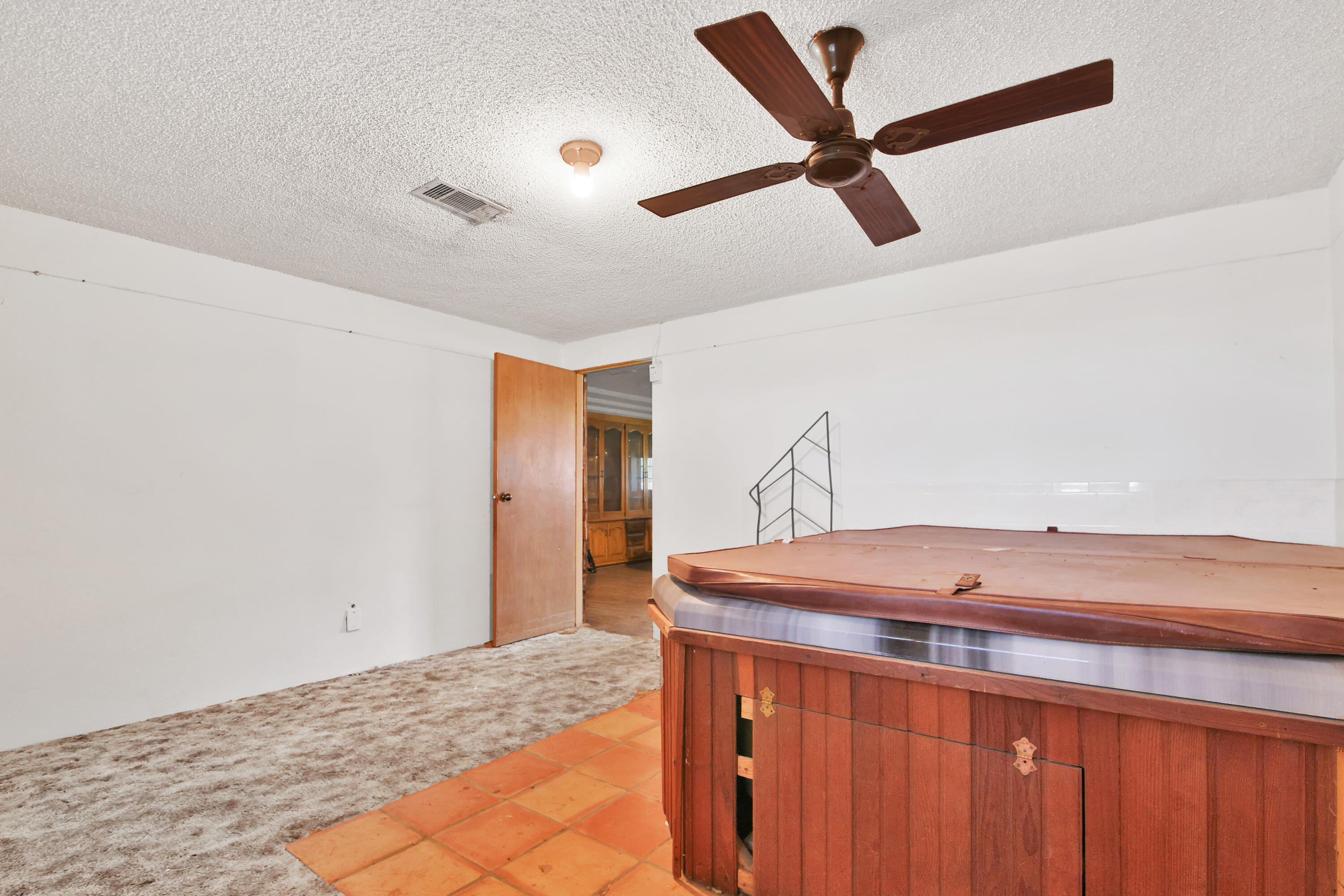 1211 140th Street Lubbock, TX 79423 - Photo 18 of 48 a room with a ceiling fan