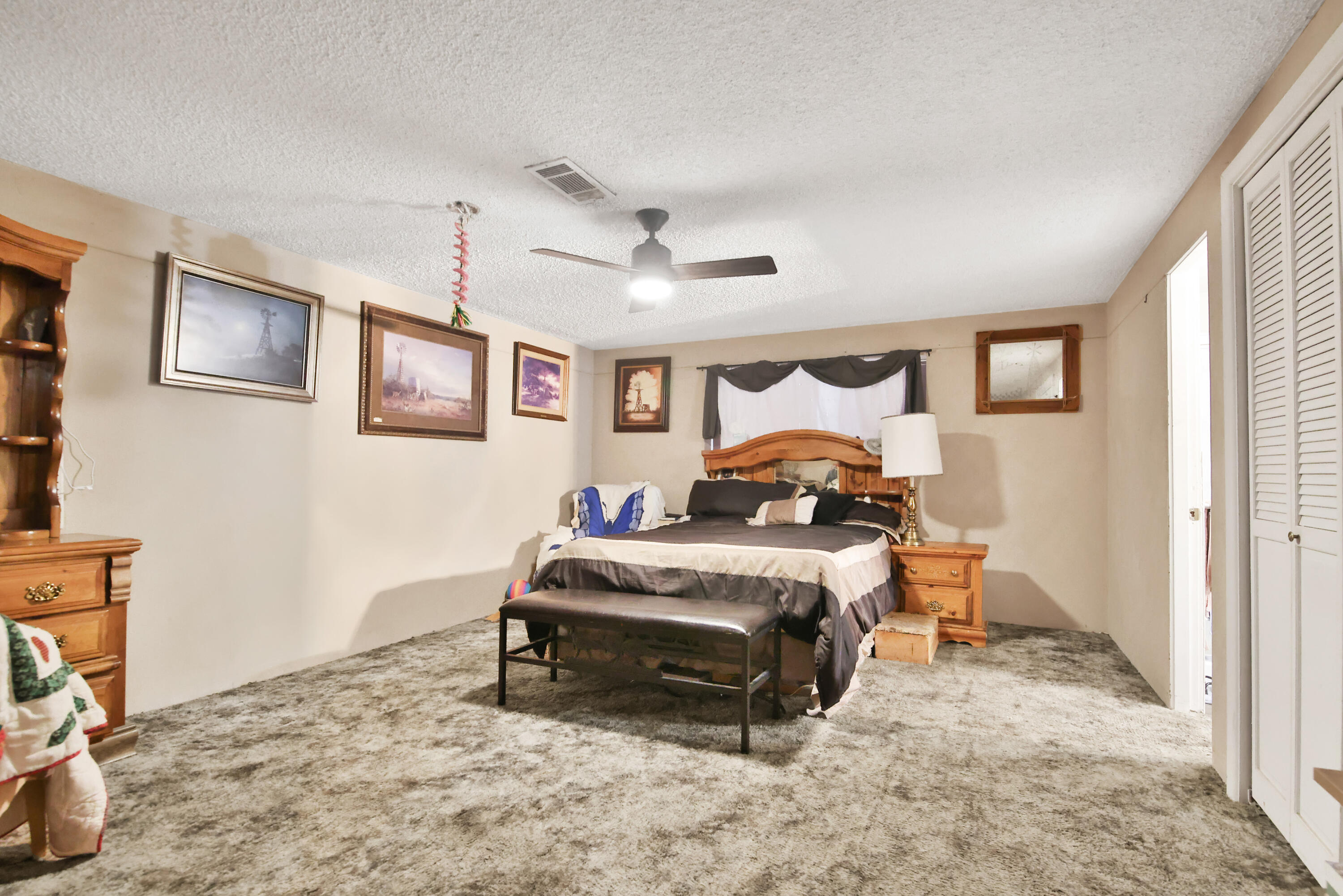 1211 140th Street Lubbock, TX 79423 - Photo 19 of 48 a bedroom with a bed and a window