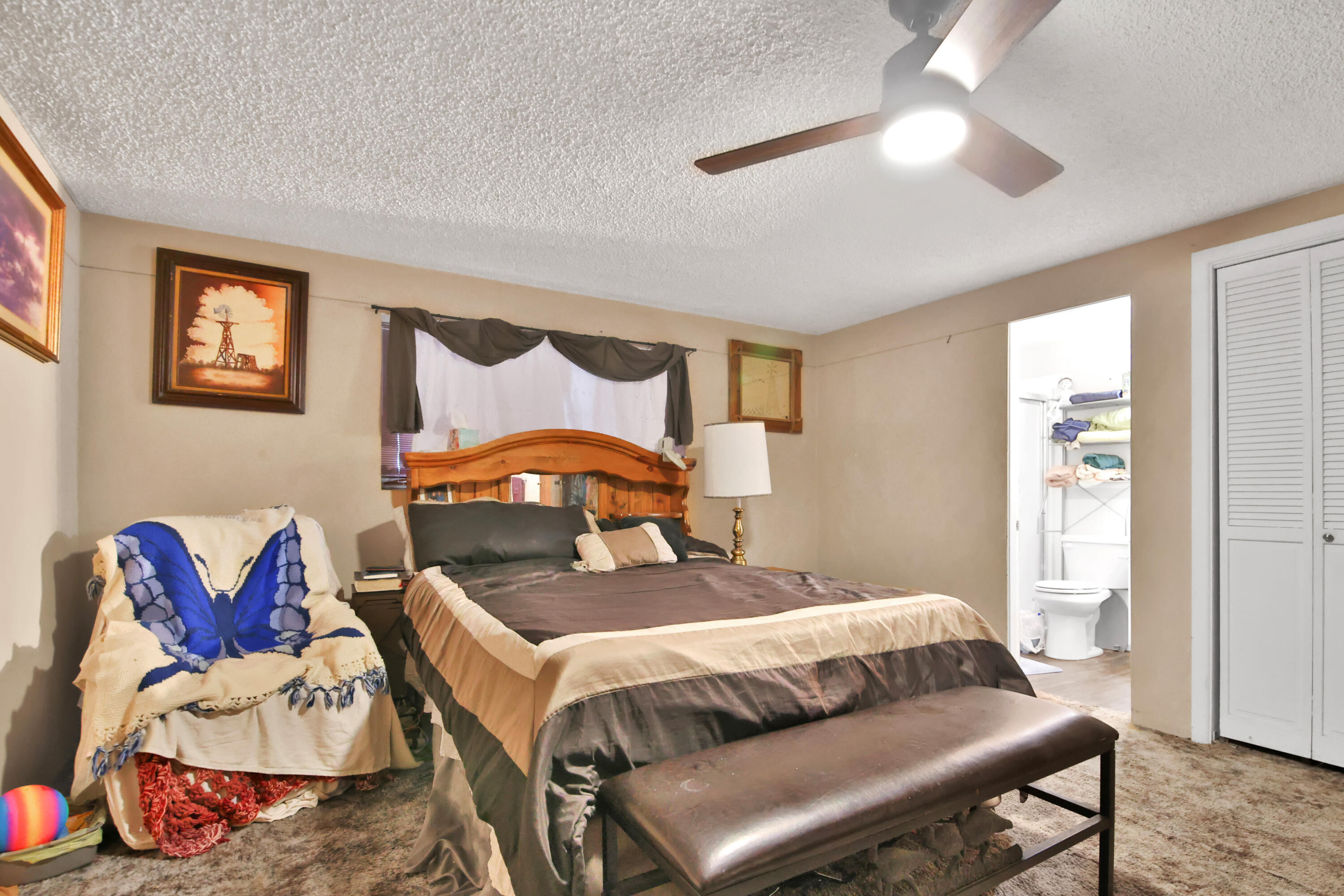 1211 140th Street Lubbock, TX 79423 - Photo 20 of 48 a bedroom with a bed and wooden floor