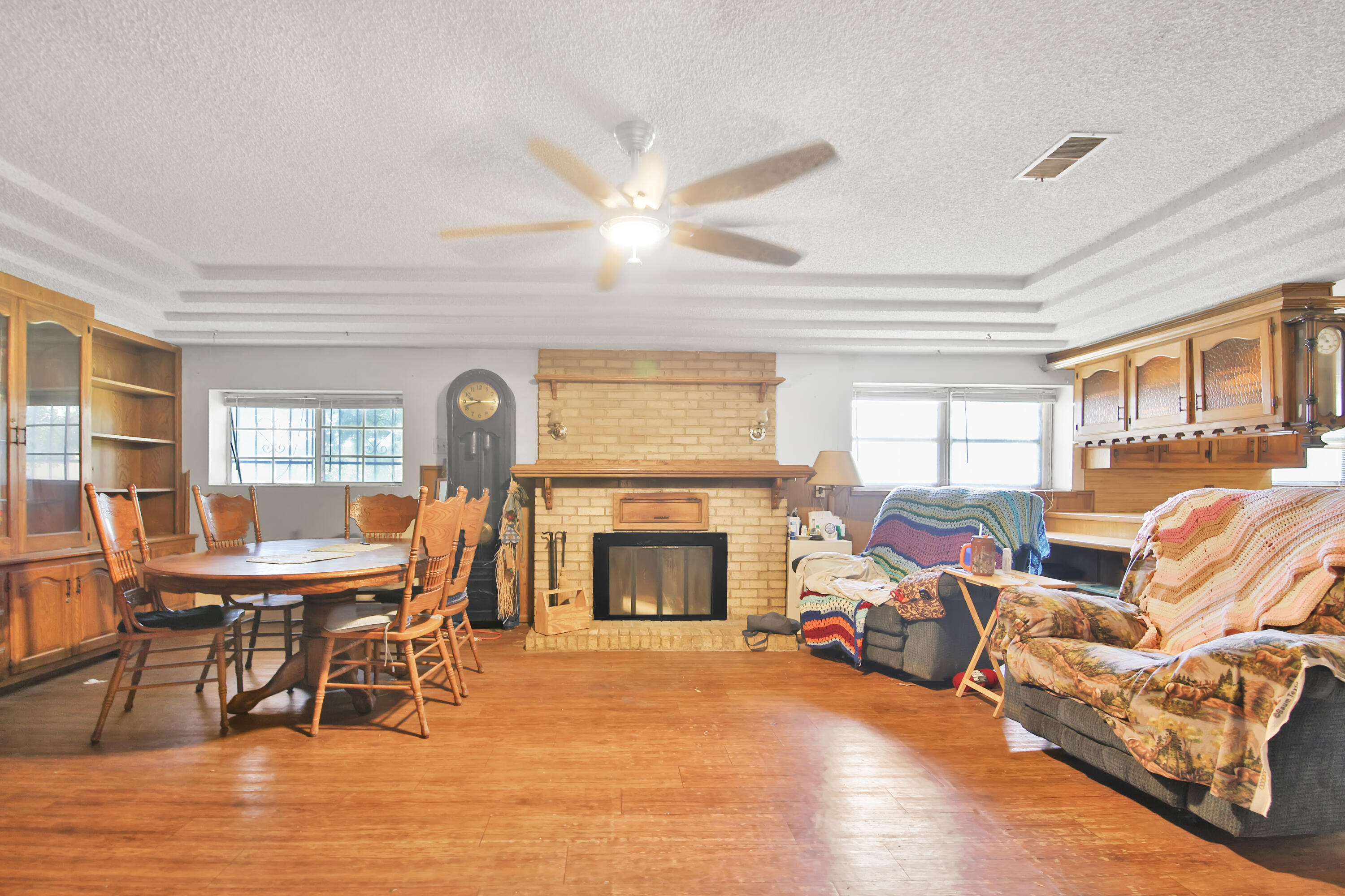 1211 140th Street Lubbock, TX 79423 - Photo 33 of 48 a living room with furniture a fireplace and a large window