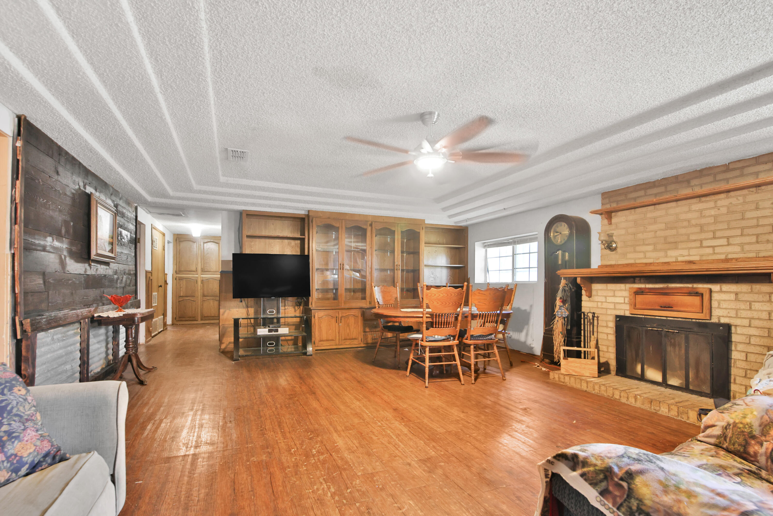 1211 140th Street Lubbock, TX 79423 - Photo 34 of 48 a living room with furniture and a fireplace