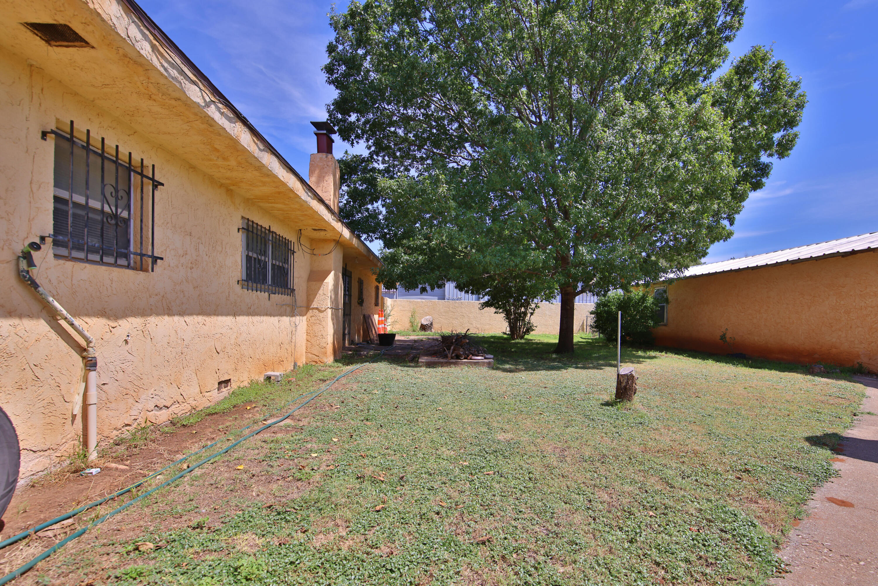 1211 140th Street Lubbock, TX 79423 - Photo 38 of 48 a backyard of a house with a tree